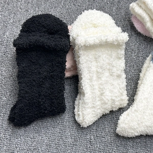 Thick coral fleece thermal socks in black and white colors for winter home wear
