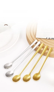 Set of five long-handle stainless steel stirring spoons in gold and silver finishes