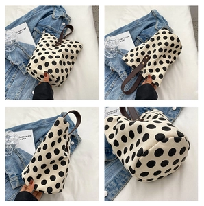 Polka dot canvas bucket bag with brown handles in a collage showing multi-angle details