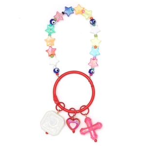 Detail of DIY keychain with blue evil eye beads and colorful transparent star charms
