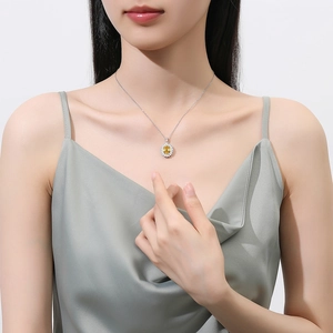 S925 silver necklace with sunflower pendant featuring a yellow center stone on a model