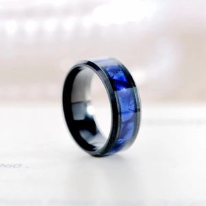 Detail view showing the elegant blue marbled inlay of this black titanium steel ring