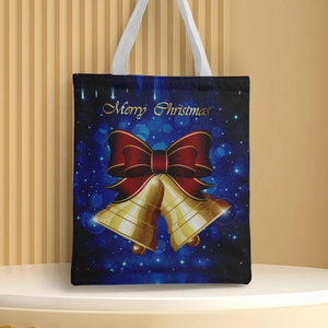 Close-up of Navy Christmas canvas tote bag featuring golden bell design and festive lettering