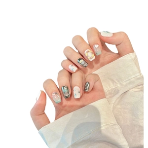 Y2K press-on nails featuring 3D stars, hearts, and pearls in silver and white finish