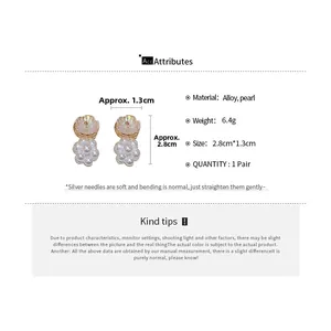 Detail view of pearl flower earrings with alloy base, dimensions 2.8cm by 1.3cm