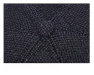 Macro detail showing the reinforced stitching and mesh texture on the navy winter hat crown