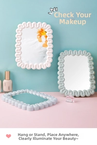 Detail of wavy frame makeup mirror showing versatile wall-mounted and tabletop standing options
