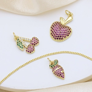 Gold necklace set with apple cherry and acorn pendants featuring red and green zircon crystals