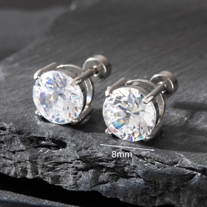Macro shot of 8mm round cubic zirconia stud earrings with silver-tone four-prong setting