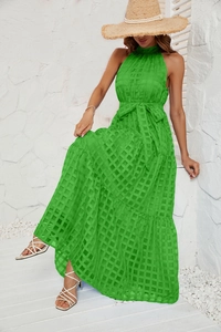 Detail of vibrant green plaid halter maxi dress with tiered ruffle skirt and waist tie