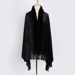 Detailed view of winter black faux fur shawl featuring long fur collar and fringe tassels