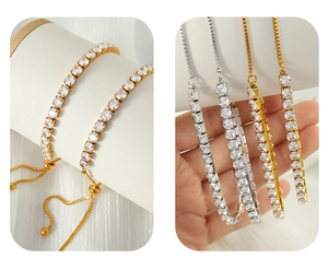Adjustable tennis bracelet with round cubic zirconia stones and sliding metal closure