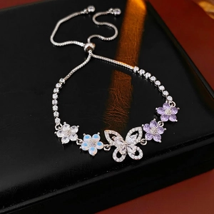 Elegant silver-toned flower and butterfly drawstring bracelet with zircon inlay