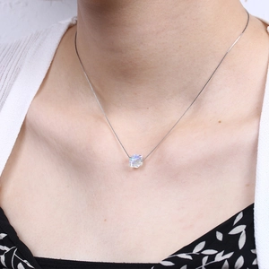 Elegant S925 silver necklace with cubic aurora crystal pendant on a female model
