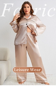 Detail of satin pajamas set showing silk texture and black contrast piping on champagne fabric