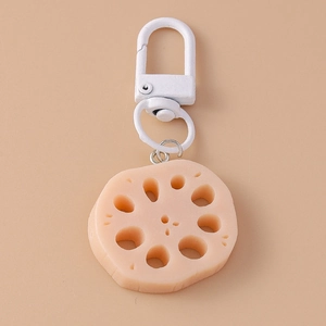 Detailed view of creative pink lotus root slice food keychain with metal clasp