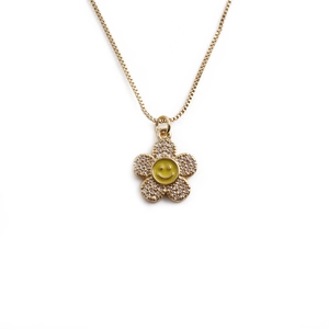 Golden flower pendant necklace with zircon petals and a yellow smiley face center
