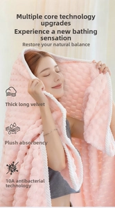 Close-up of pink soft coral fleece towel with waffle texture and 10A antibacterial fibers