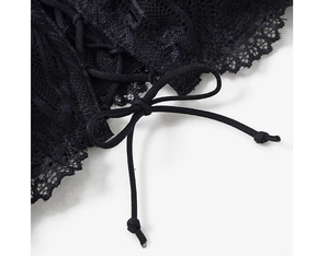 Detailed view of black lace bandeau with adjustable back criss-cross lace-up bow closure
