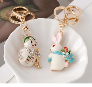 Exquisite snowman and rabbit keychains with enamel and sparkling rhinestones