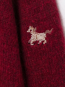 Detail of red mohair knit cardigan with handcrafted white and gold beaded horse embroidery