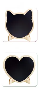 Detail of mini wooden heart and cat-shaped chalkboards with display stands for decor