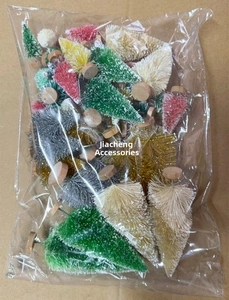 Detail of colorful mini sisal Christmas trees with wood bases in bulk plastic packaging