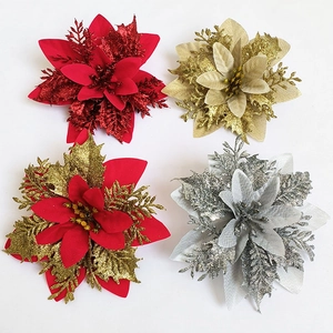 Sparkly 14cm artificial Christmas poinsettia flowers in red, gold, and silver colors