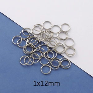 Detailed view of silver stainless steel 1x12mm double loop split rings for jewelry making