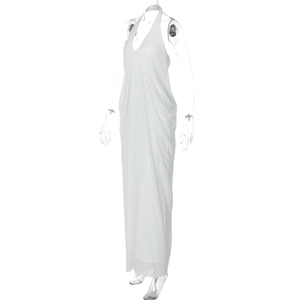 Close-up of white halter maxi dress with deep V-neck and elegant draped pleats detailing