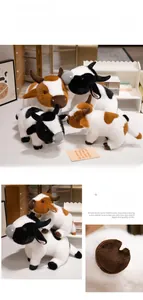 Detailed view of soft brown and white plush cow dolls with fine stitching and textures