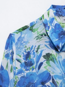 Detailed view of bohemian floral print blouse with lapel collar and light chiffon fabric