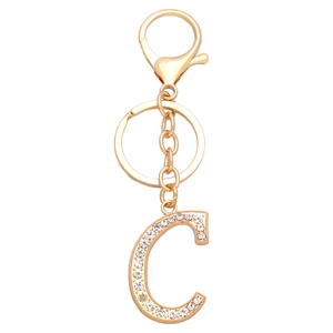 Detailed close-up of golden letter C keychain with sparkling rhinestones and lobster clasp