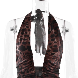 Detail of leopard print halter neck dress featuring pleated chest and mesh texture