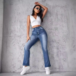 Fashionable high-waist flared blue denim jeans for women with distressed wash details