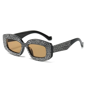 Sparkly rhinestone cat-eye sunglasses with black frame and brown lenses for party wear