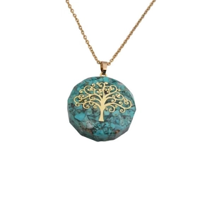 Detailed close-up of tree of life pendant with turquoise stones and golden chain