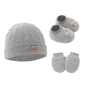 Three-piece grey knit baby set with hat, rabbit booties, and mittens on white backdrop