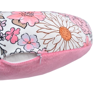 Close-up of floral nursing pillow cover featuring pink plush fabric and a hidden zipper