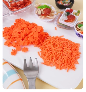 Macro shot of orange flower and stick polymer clay slices for DIY food play and crafts