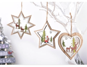 Detail of laser-cut wooden Christmas star ornaments with reindeer and Santa designs