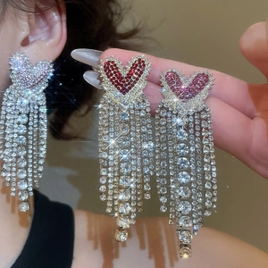 Sparkling crystal heart fringe earrings featuring long tassels in silver, red, and pink colors