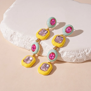 Macro shot of candy-colored geometric necklace with pink crystals in square and oval settings