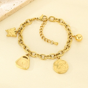 Detailed close-up of 18K gold plated charms including butterfly and heart lock on bracelet