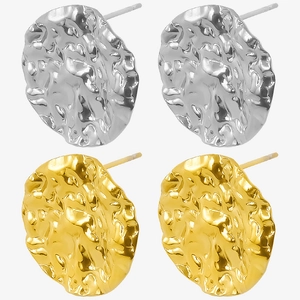 Detailed macro view of 304 stainless steel stud earrings in gold and silver textured finish