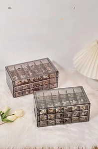 Three-layer clear jewelry box with multiple drawer dividers for rings and earrings