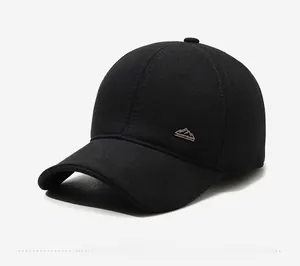 Detailed view of winter wool baseball cap featuring a silver mountain sport metal logo