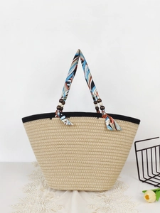 Retro straw tote bag with colorful silk ribbon handle and wooden bead accents