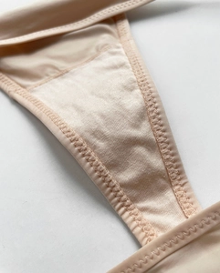 Macro detail of the smooth ice silk fabric and reinforced cotton crotch stitching
