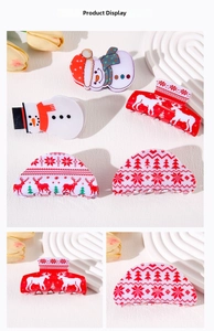 Close-up of Christmas hair claws featuring snowman and reindeer festive patterns